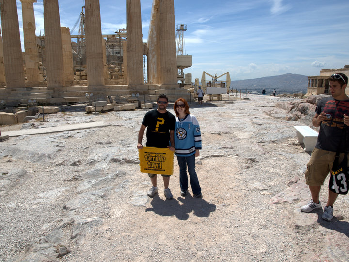Melissa and her cousin at Greek ruins dressed in Pittsburgh sports jerseys