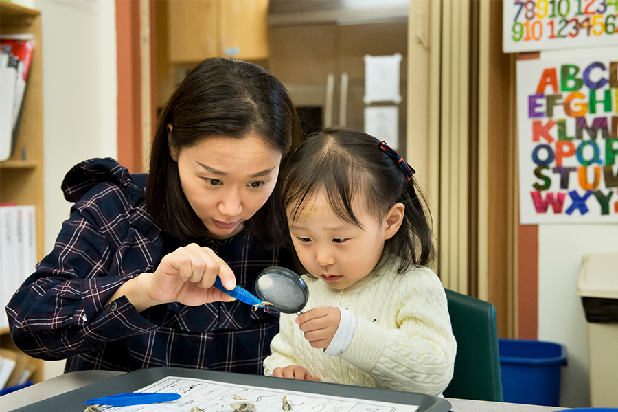 Child examining owl pellets.