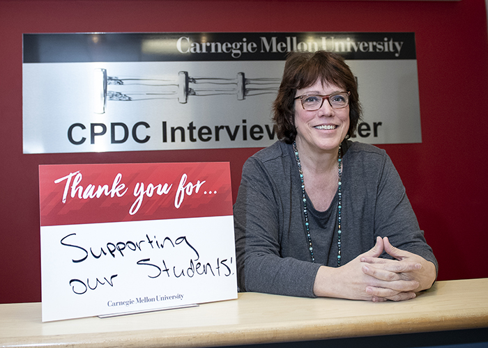 CMU Students Hold Sign Thanking Donors