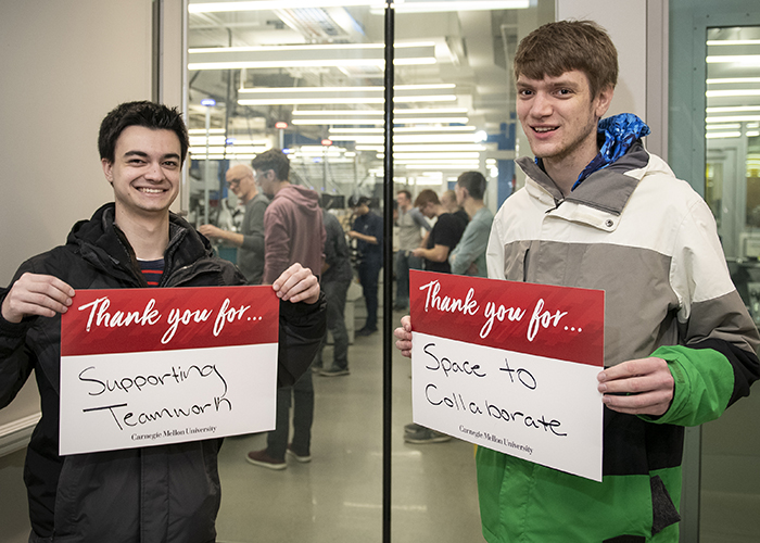 CMU Students Hold Sign Thanking Donors