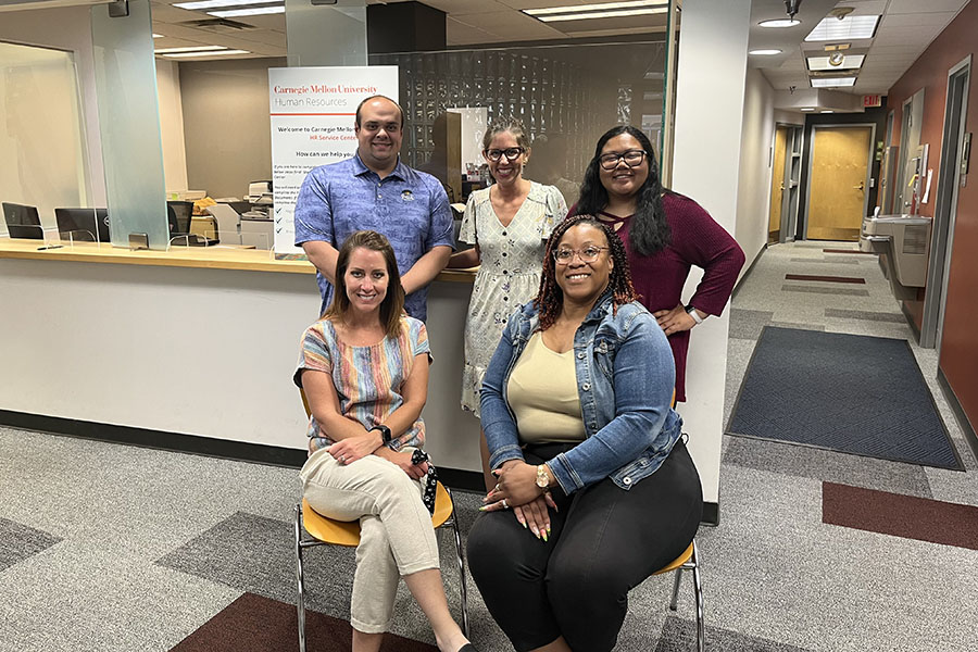 group picture of Student Worker Services team's five members posing in the HR Service Center