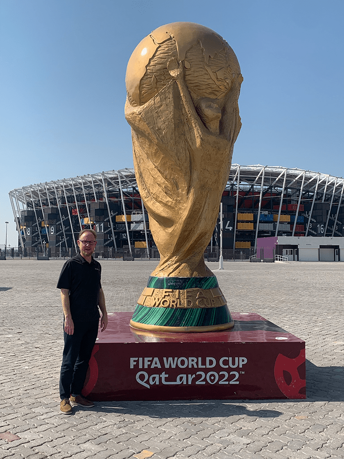Adam Marks with FIFA World Cup 2022 Statue