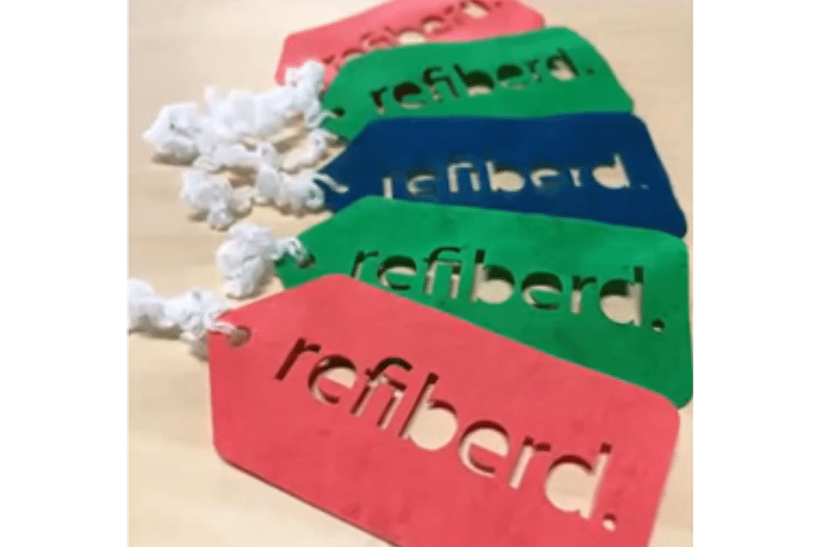 Paper labels made from Refiberd's 100% recycled textiles