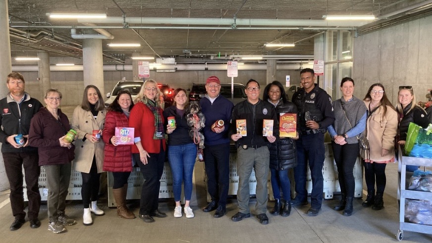 A group of people donate food to the CMU food drive..jpg