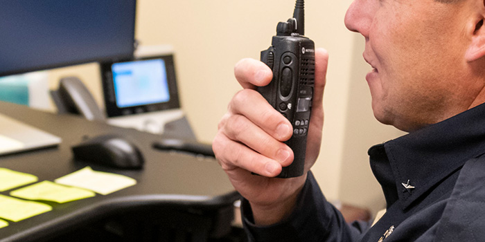 CMU officer on walkie-talkie