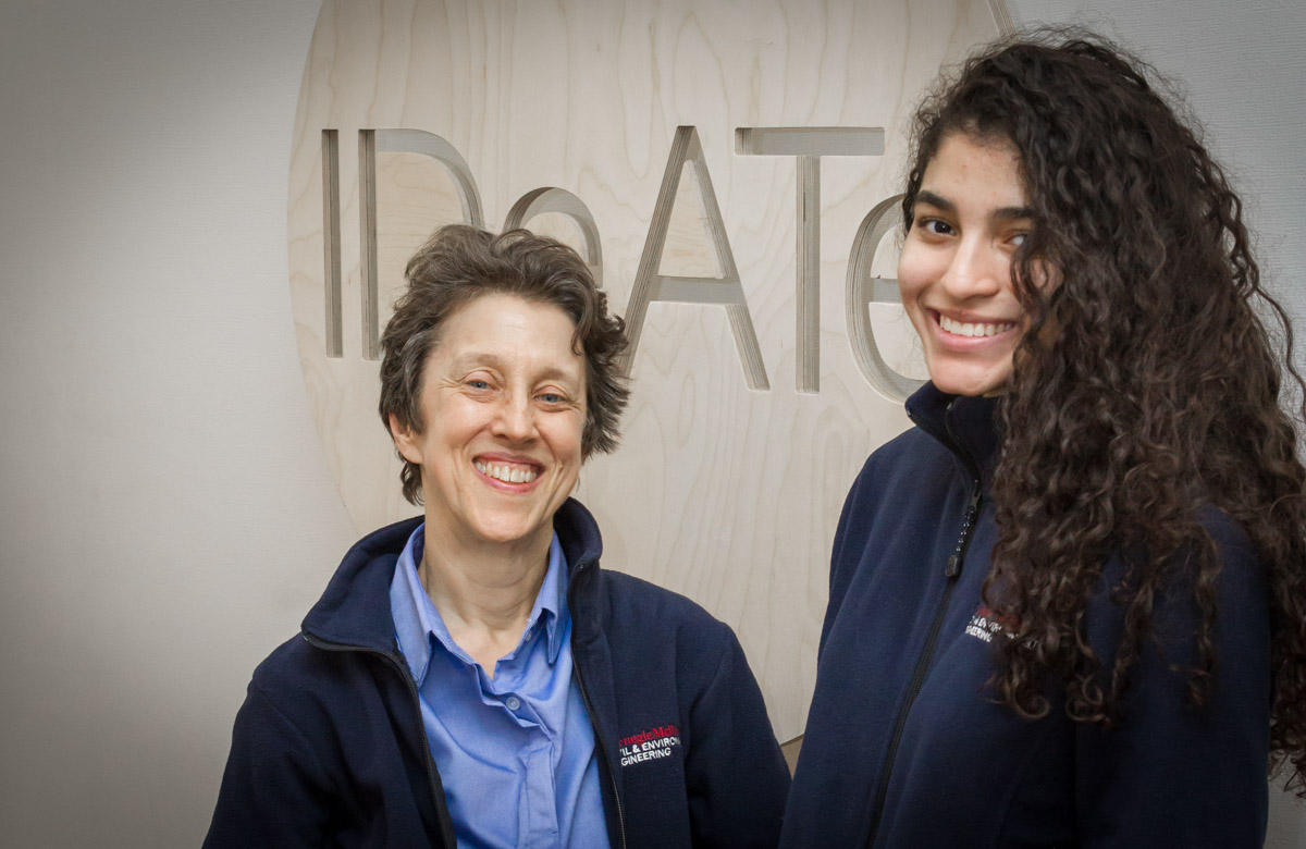 Professor Susan Finger and UG Morgan Reed in front of IDEaTe sign