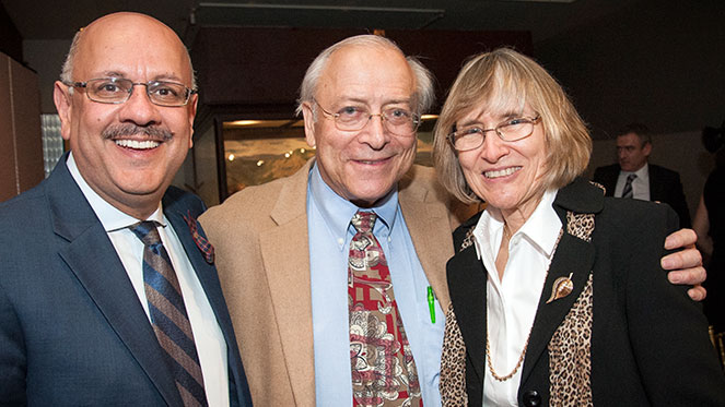 Stephen E. Fienberg (center) stands with his wife Joyce (right) and CMU Provost Farnam Jahanian at a dinner honoring him and his career.