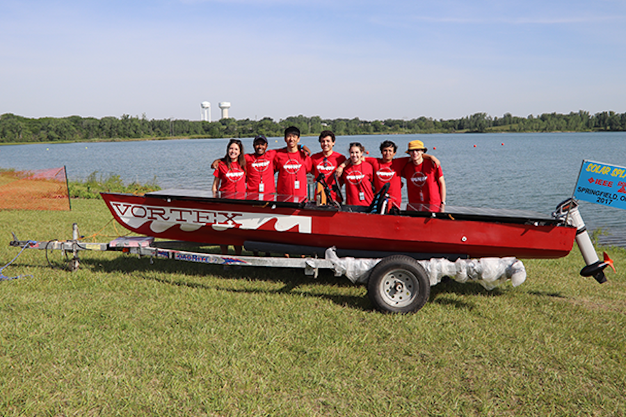 CMSR team and their handcrafted solar-powered boat