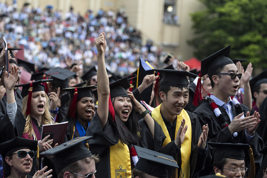 Students cheering at graduation 