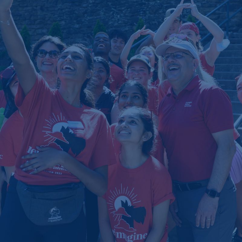 Students taking a selfie with President Jahanian