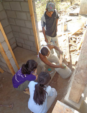 Students building a door