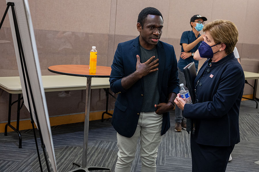 student talks to vice provost