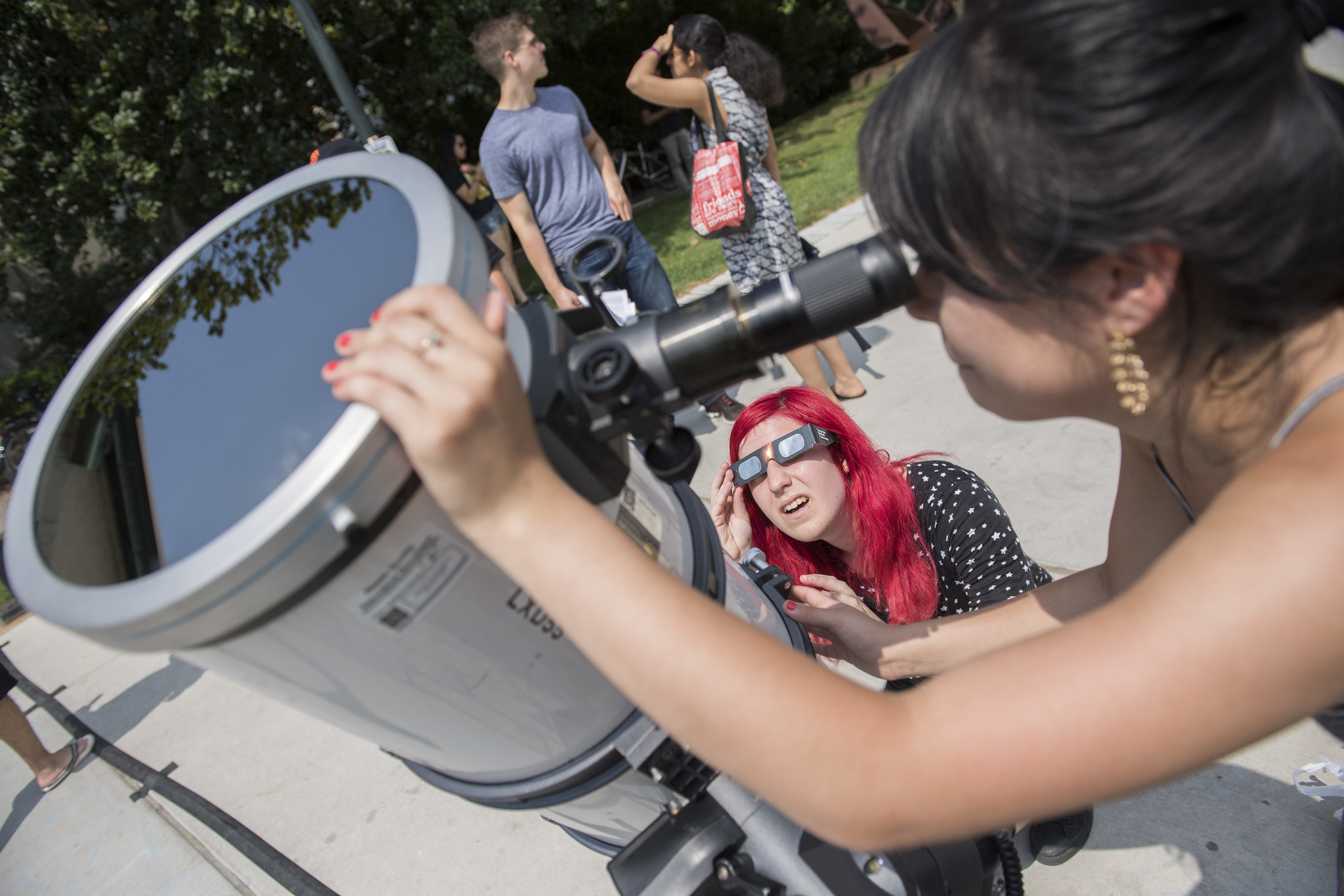 a student helps set up a specialized telescope during the August 21, 2017 eclipse, which passed over Pittsburgh