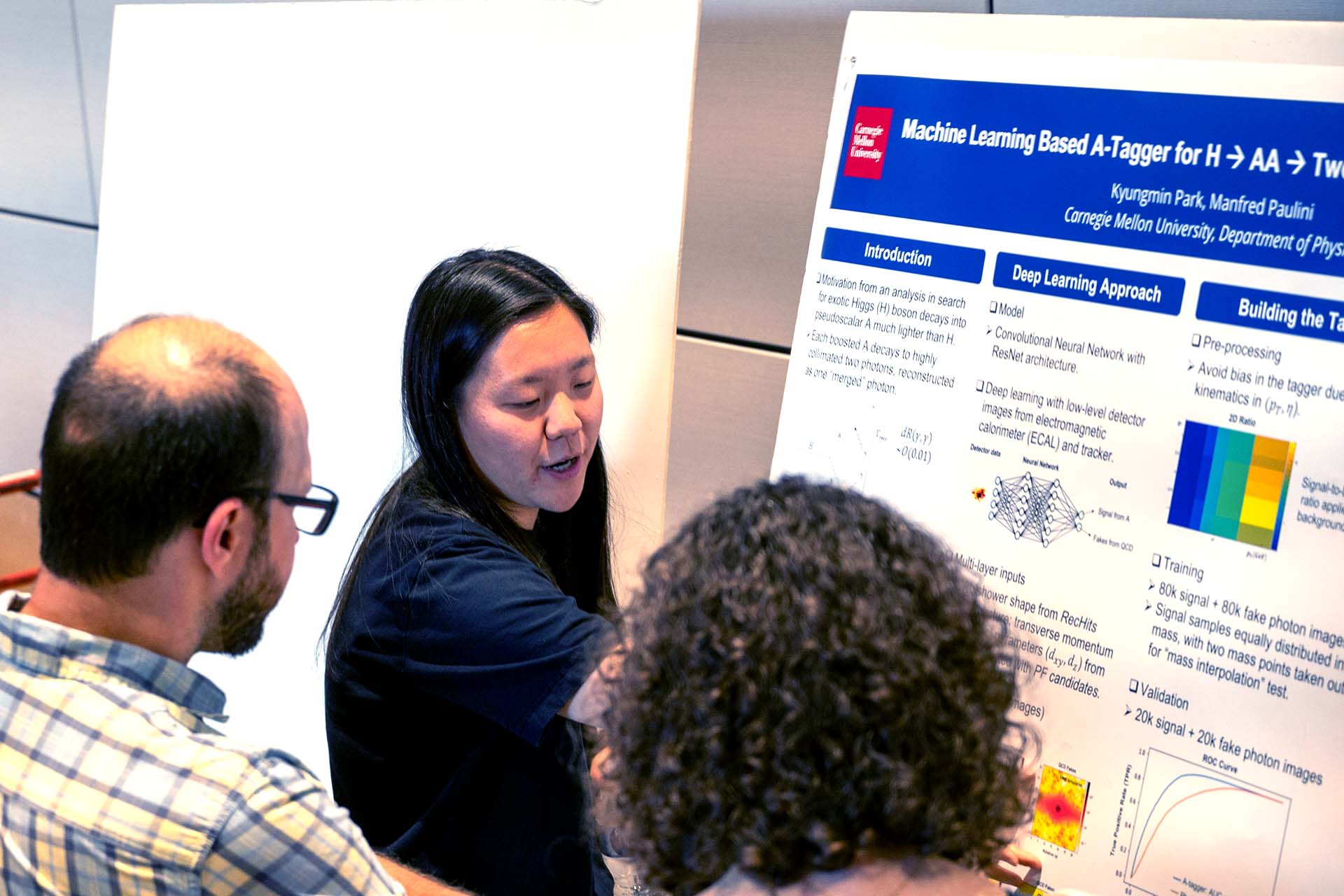image of Kyungmin Park explaining her research at a poster session
