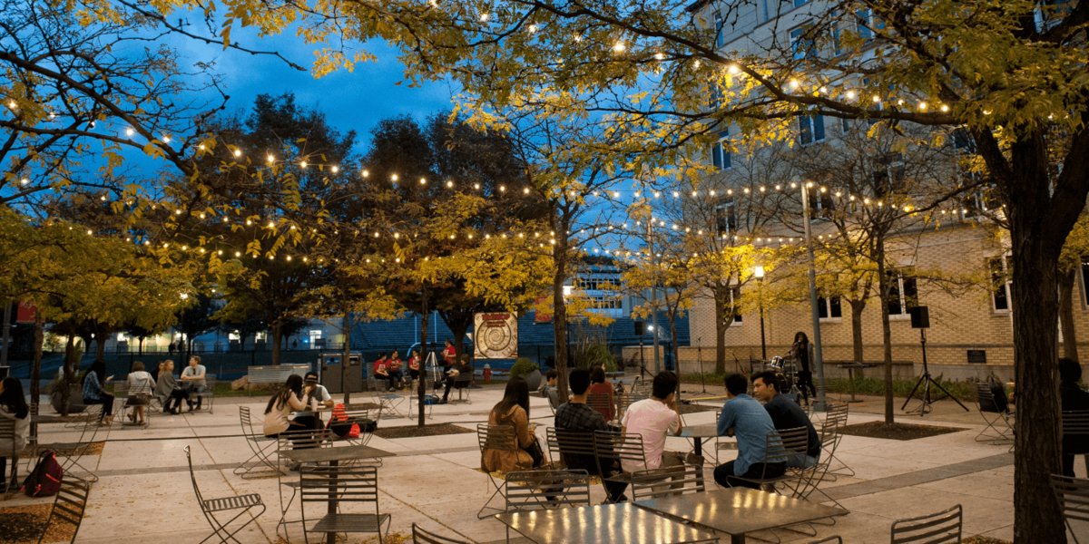 Students speak in a courtyard at CMU.