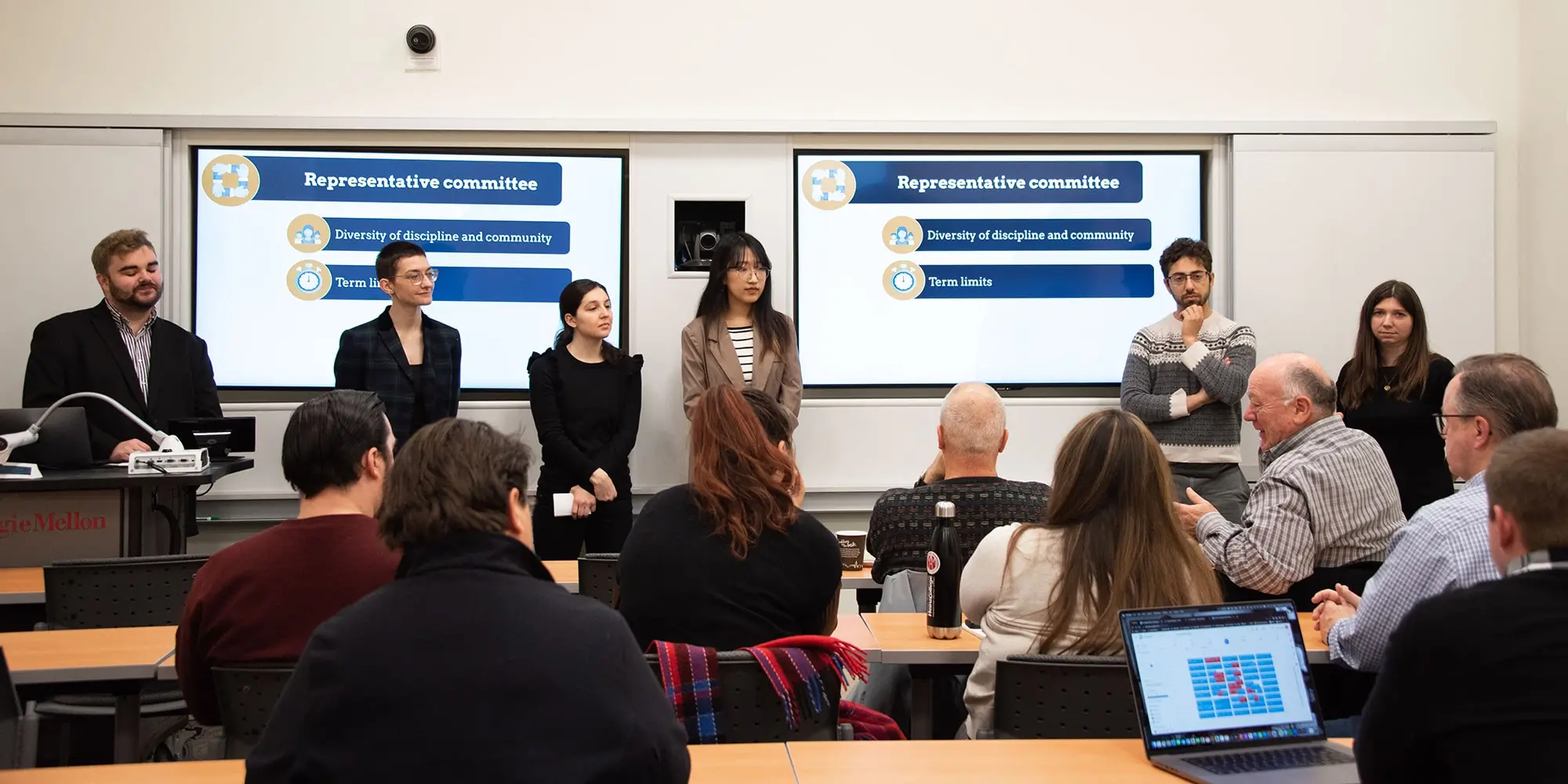 Students presenting at front of classroom