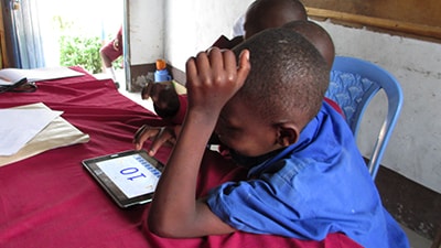 Image of a student working on a tablet
