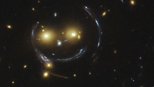 Image of two galaxies that looks like a smiley face