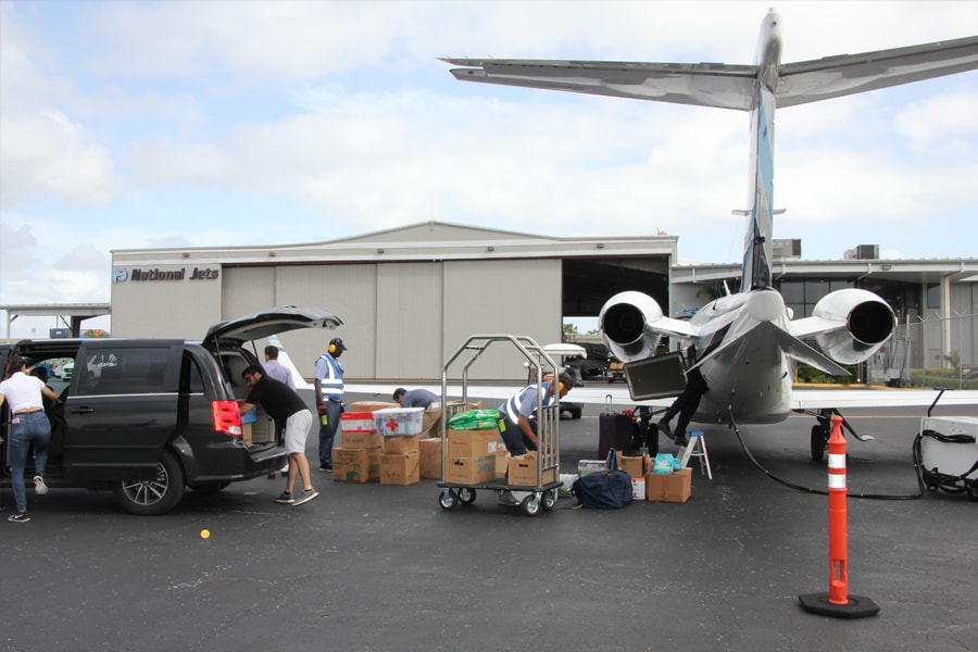 Image of airplane being loaded with supplies