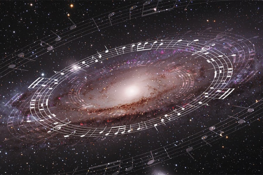 Image of music notes overlaid on the Andromeda galaxy