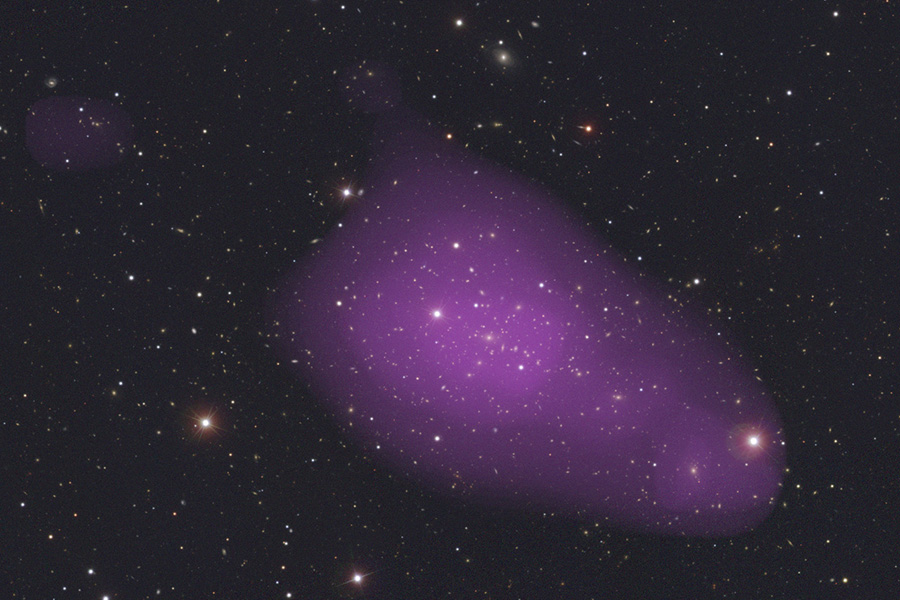 Galaxy Cluster Abell 1763. The image shows the galaxy content, produced from SDSS images from g,r, and i bands, overlaid with the extended X-ray emission from XMM. 