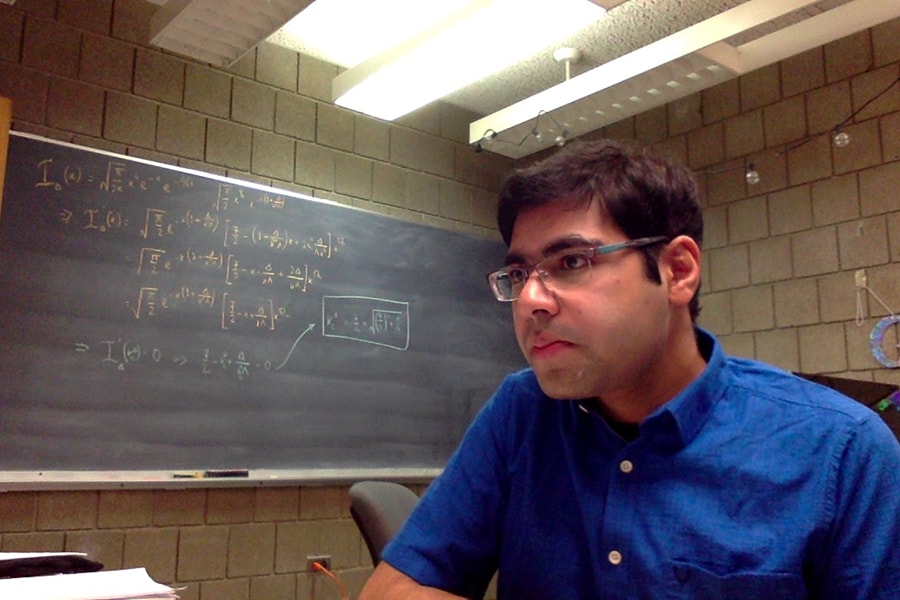 Sayan Mandal conducting research in his office