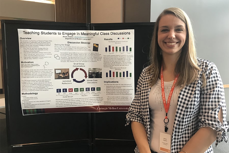 Lexi Adams standing next to a poster with text on it