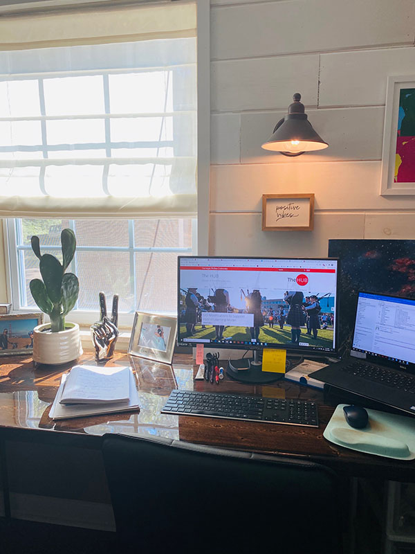 Home office with nick-knacks spread out on a desk.