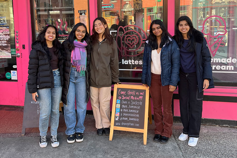 Case competition team in front of Churn storefront