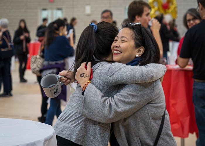 CMU student hugs family member at Family Weekend