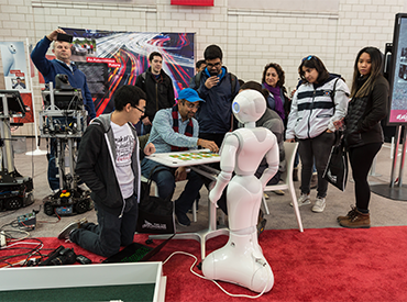 Robot playing Go Fish in the Exposition