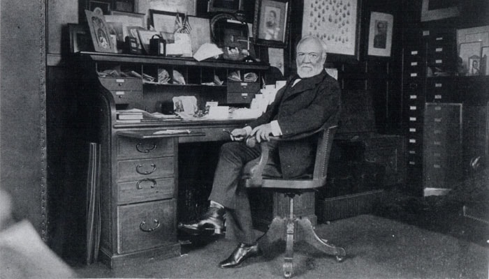 Andrew Carnegie at a desk