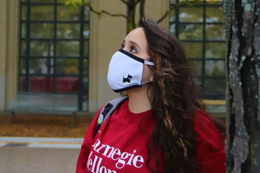 Student with mask and CMU sweatshirt