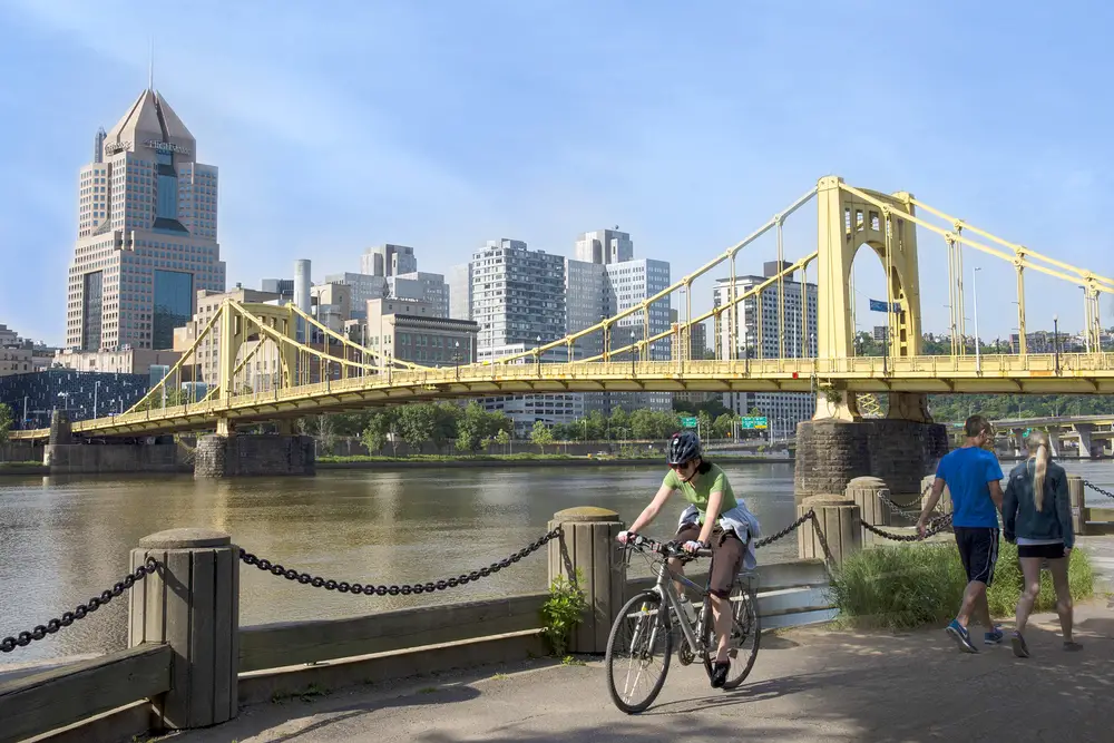 City of Pittsburgh, bridge and people biking and walking the trail near the river