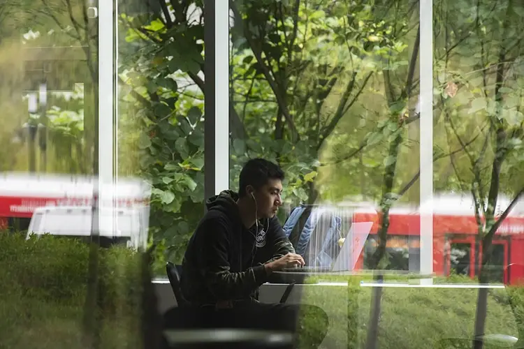 A student working on his laptop