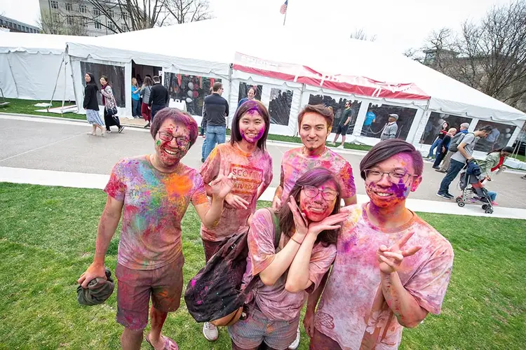 Students at CMU's Carnival Sweepstakes covered in colorful paint
