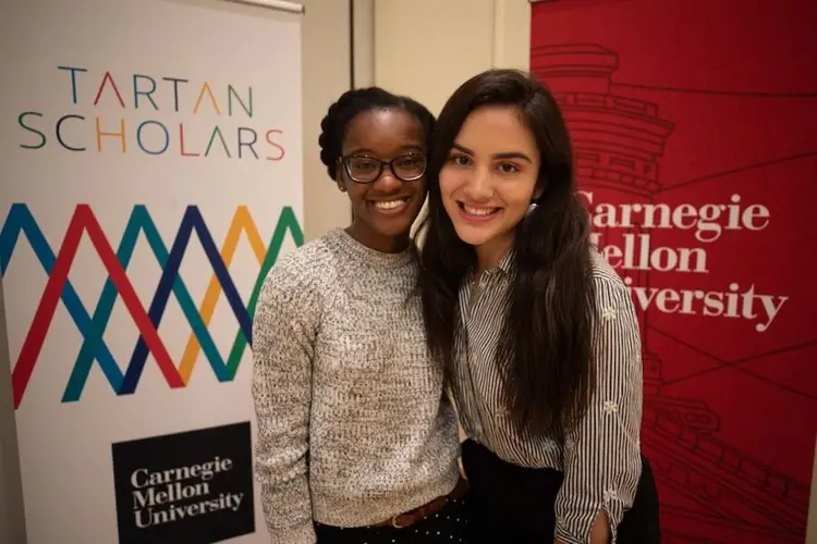 Two Tartan Scholars pose at a CMU event