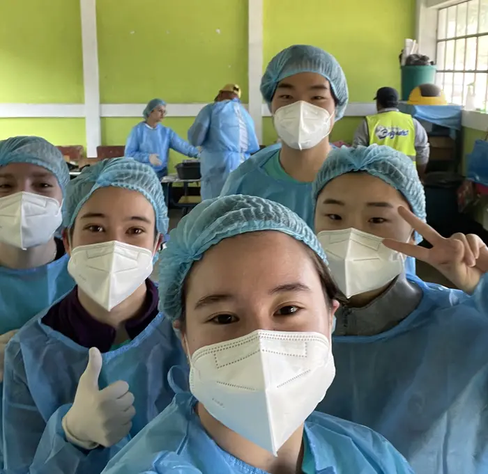Image of Rebecca working with her lab-mates