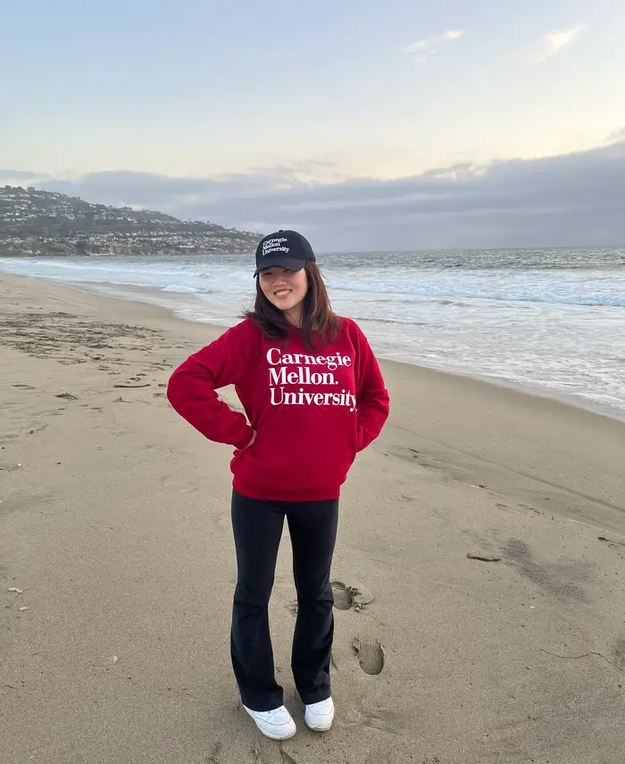 Alycen poses for a photograph on the beach