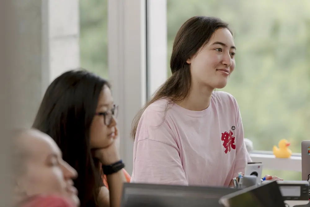 Student smiling during a lecture.