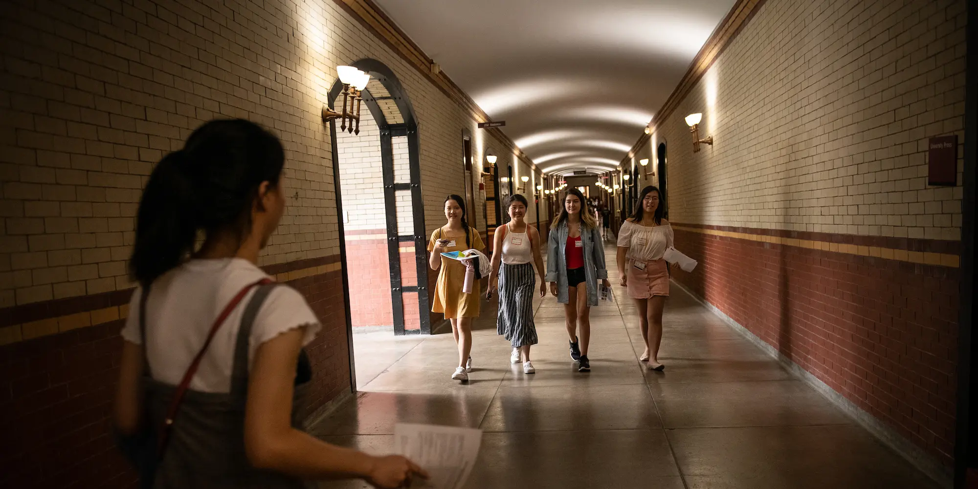 Students walking down the hallway that seamlessly joins Baker and Porter Halls.