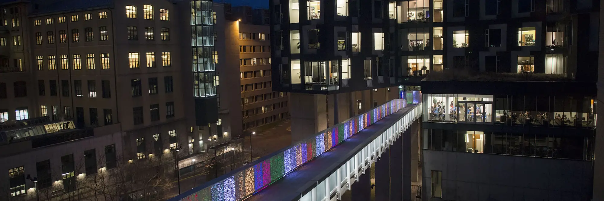 Night shot of colorful lights on CMU's Randy Pausch Memorial Bridge