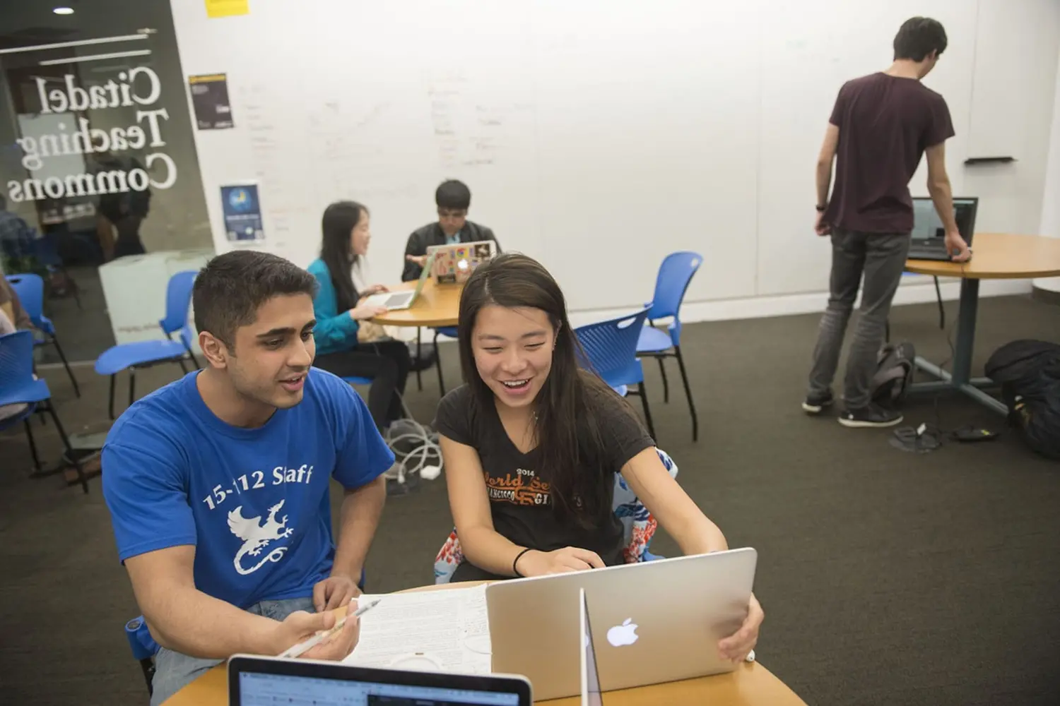 Two CMU students work together on a Mac in the Citadel Technology Commons