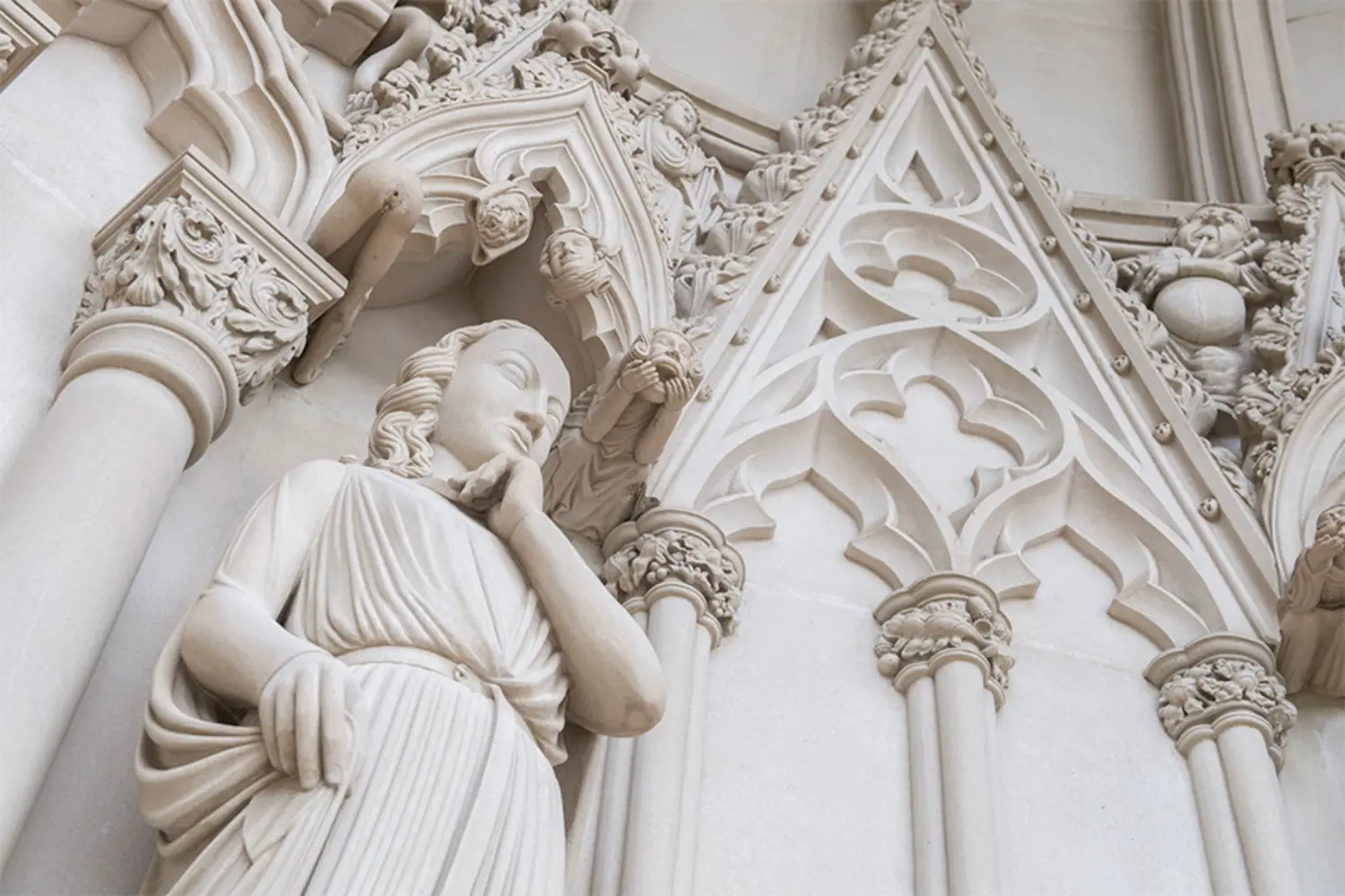 Looking up at the sculpted niches outside the College of Fine Arts.