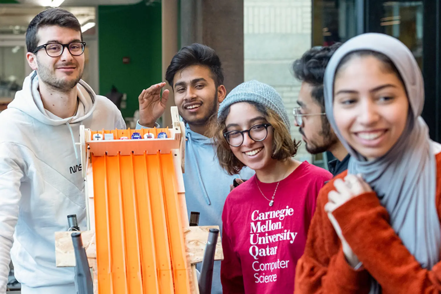 International students testing out a project together.