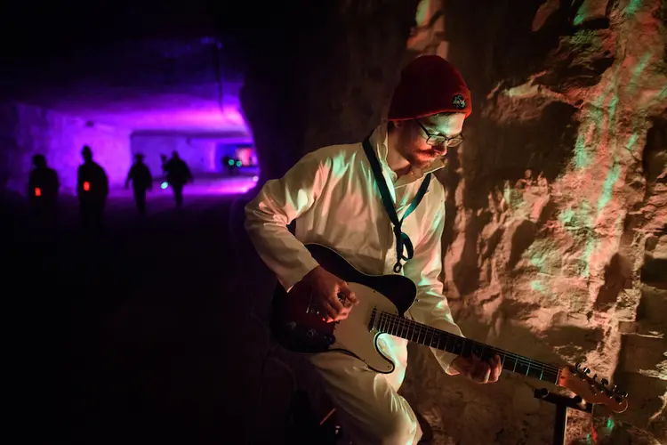 Student plays the guitar