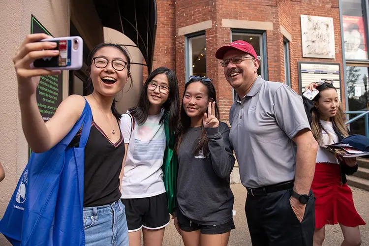 CMU students taking a selfie with President Jahanian