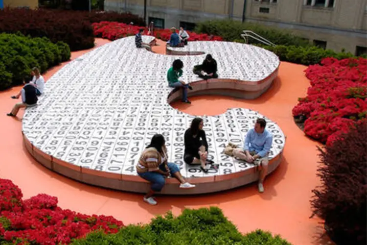 Students sitting on interactive campus art installation, the Kraus Campo.