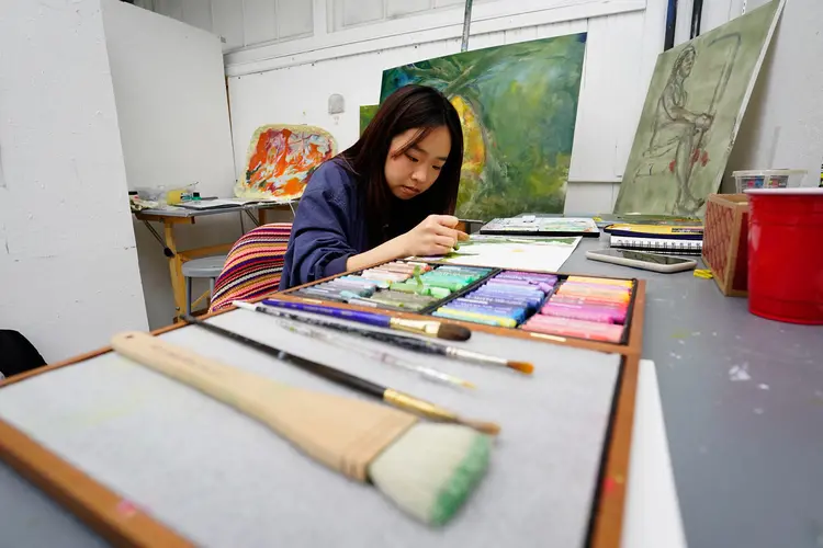 Person in Art Studio Painting