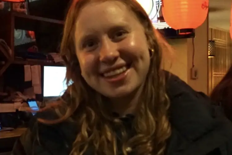 A photo of Miriam smiling.